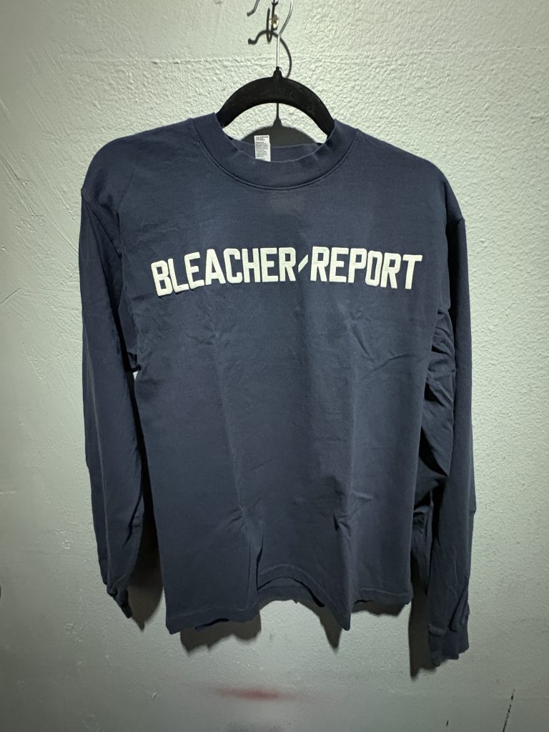 Los Angeles Apparel Bleacher Report embroidered long sleeve t-shirt in navy blue showing the front chest branding and size S tag.