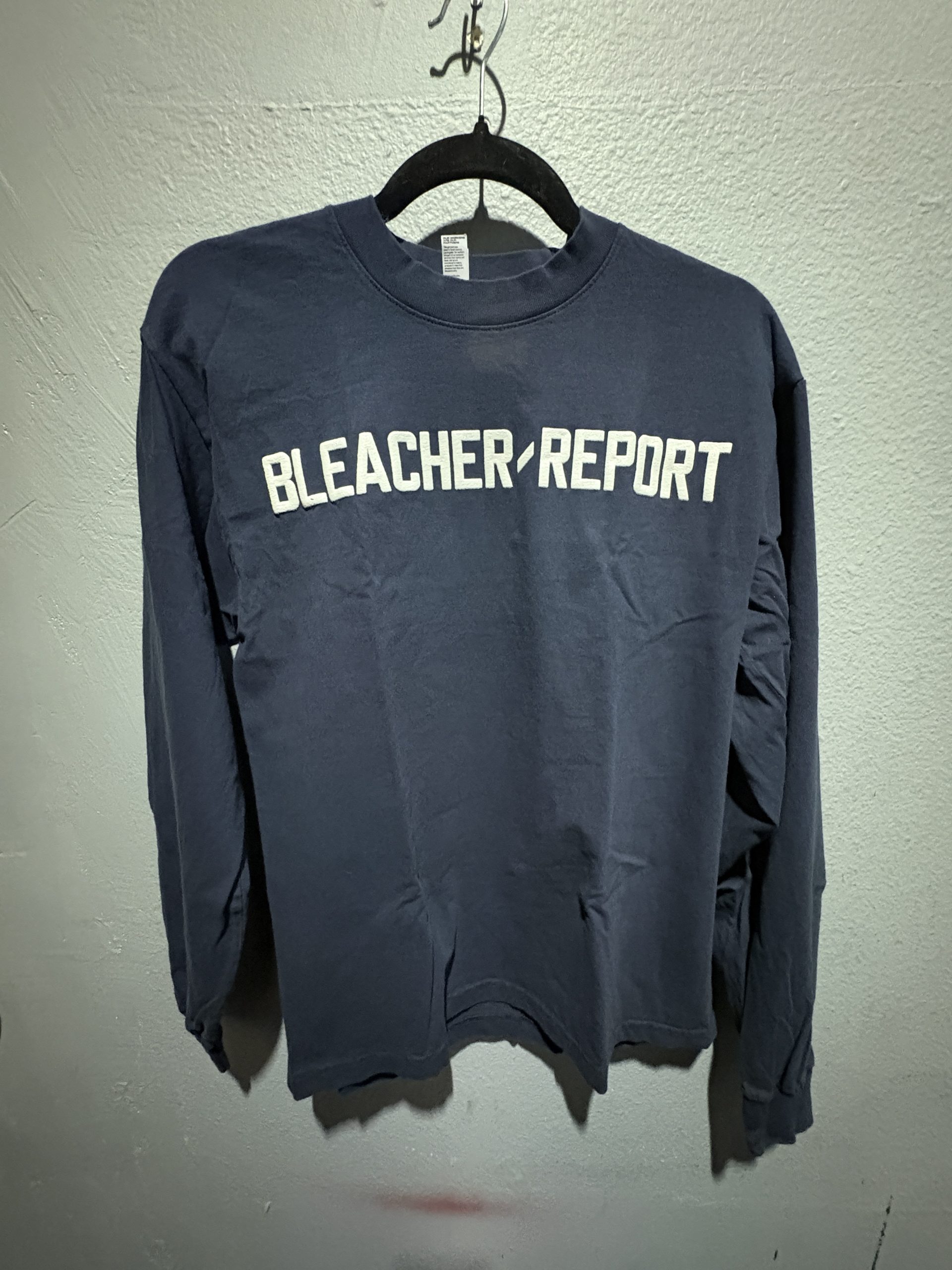 Los Angeles Apparel Bleacher Report embroidered long sleeve t-shirt in navy blue showing the front chest branding and size S tag.