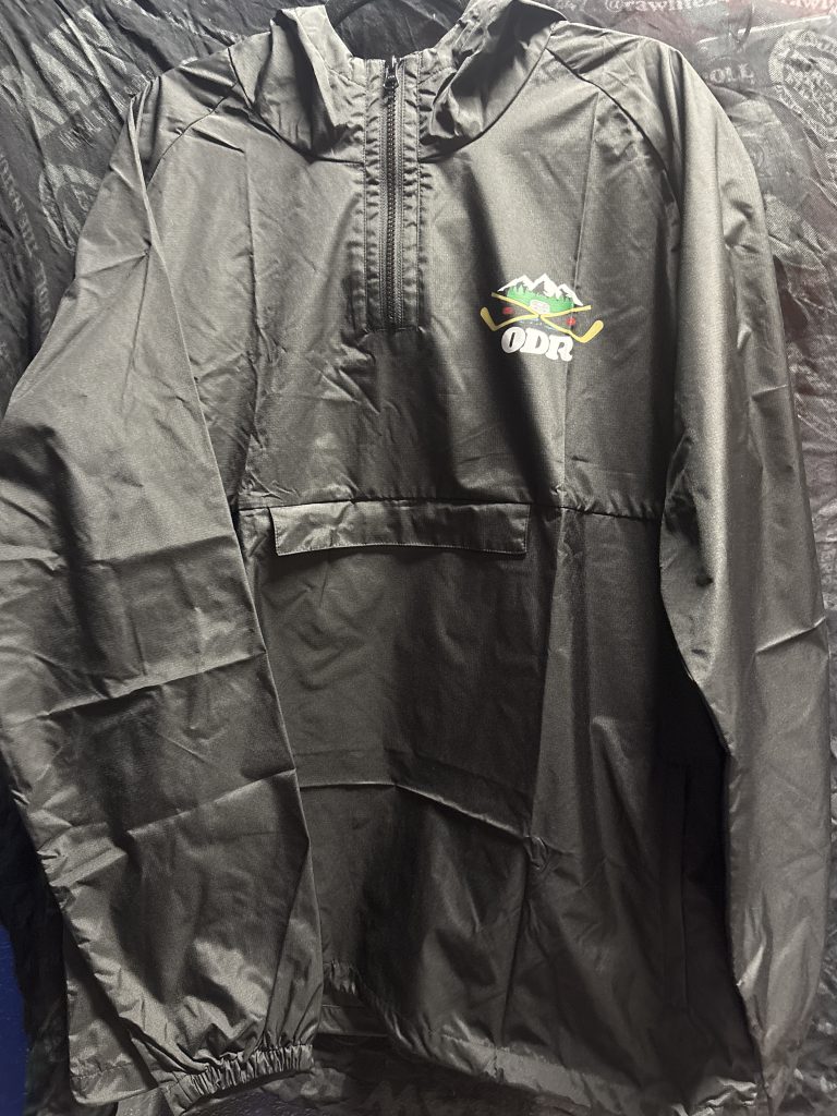 AS Colour ODR hockey mountain graphic quarter zip windbreaker jacket in black showing the chest graphic and interior XL tag.