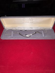 Vintage silver-tone abstract wave link necklace inside gray Amend's Jewelry presentation box from Uniontown and Connellsville PA.