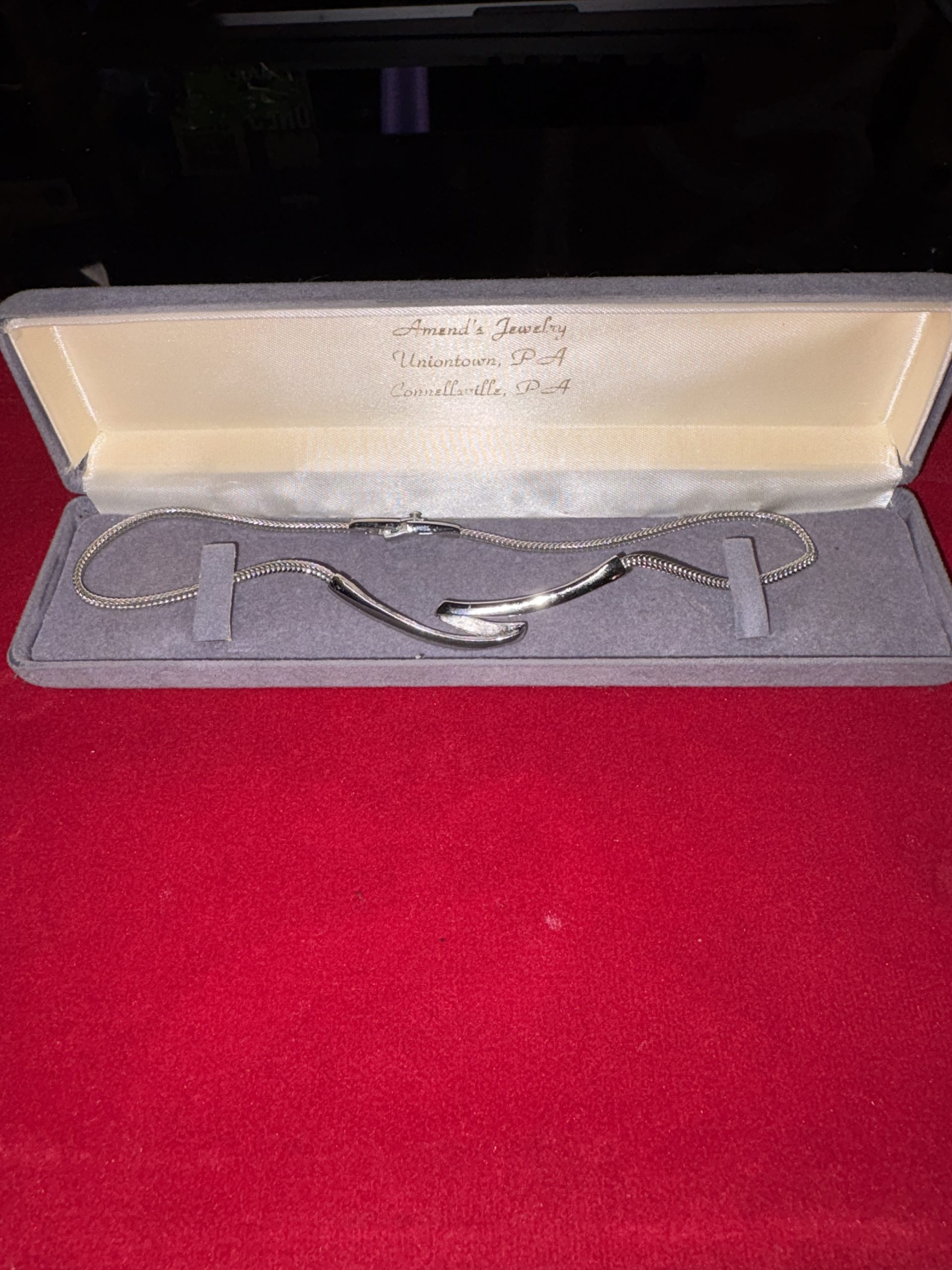 Vintage silver-tone abstract wave link necklace inside gray Amend's Jewelry presentation box from Uniontown and Connellsville PA.